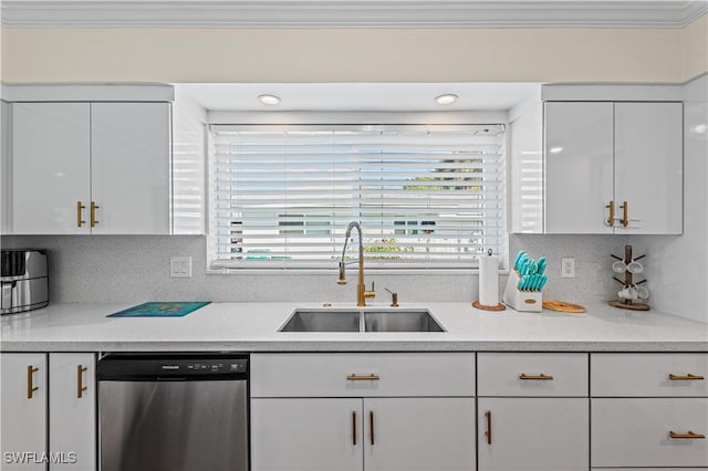 kitchen with dishwasher, sink, decorative backsplash, ornamental molding, and white cabinetry