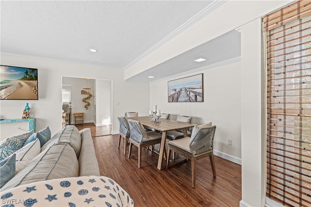 dining room with crown molding, wood-type flooring, and a textured ceiling