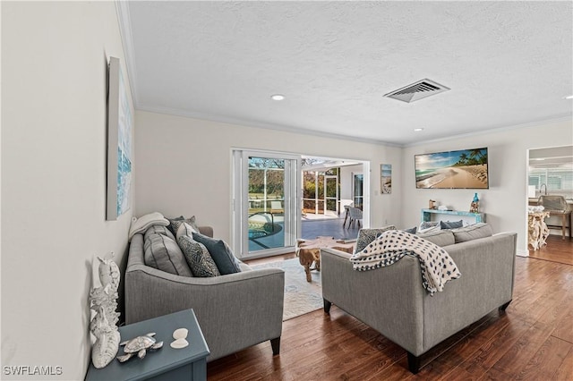 living room featuring a textured ceiling, crown molding, plenty of natural light, and dark hardwood / wood-style floors