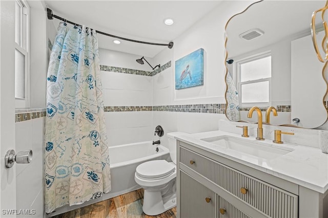 full bathroom with vanity, shower / bath combo, toilet, tile walls, and wood-type flooring