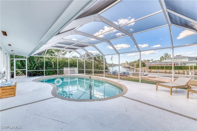 view of pool with a lanai and a patio area