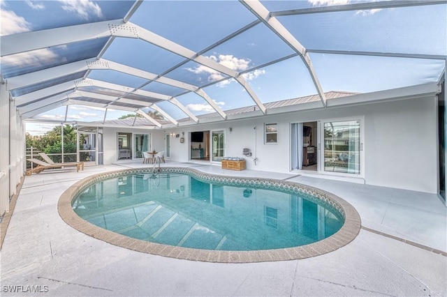 view of pool featuring a patio and a lanai