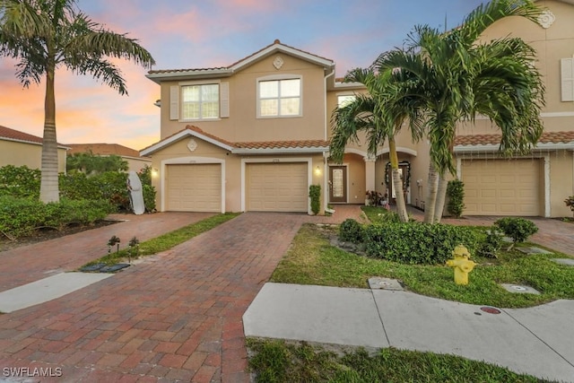 mediterranean / spanish-style home featuring a garage