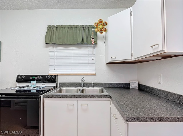 kitchen with white cabinets, a textured wall, dark countertops, black range with electric cooktop, and a sink