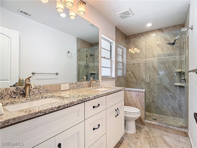 full bath featuring a stall shower, visible vents, and a sink