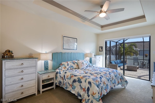 carpeted bedroom featuring ornamental molding, access to outside, ceiling fan, and a tray ceiling