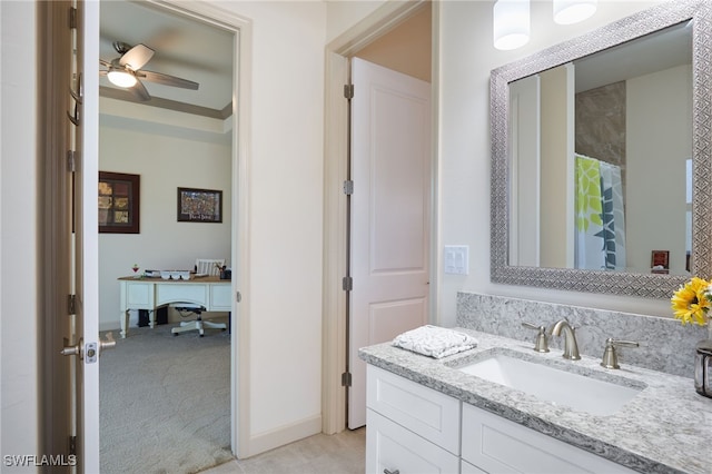 bathroom featuring a shower with shower curtain, vanity, and ceiling fan