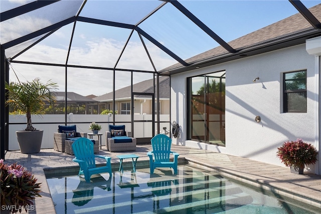 view of patio / terrace featuring glass enclosure