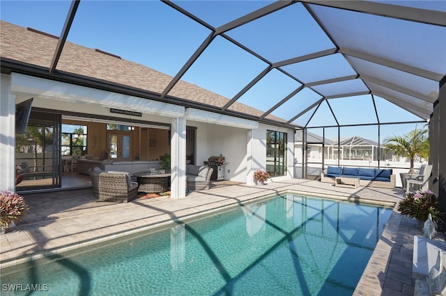 view of swimming pool with an outdoor living space, a patio, grilling area, and a lanai