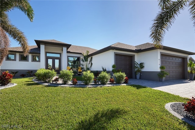 view of front facade with a front yard and a garage