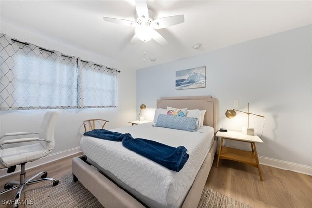 bedroom with light wood-type flooring and ceiling fan