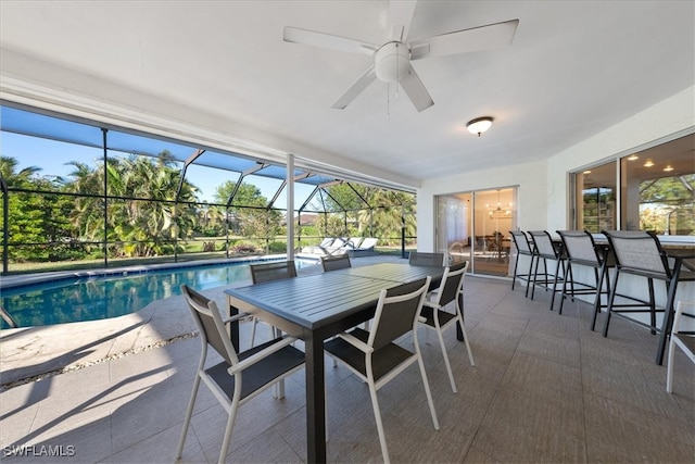 interior space with ceiling fan