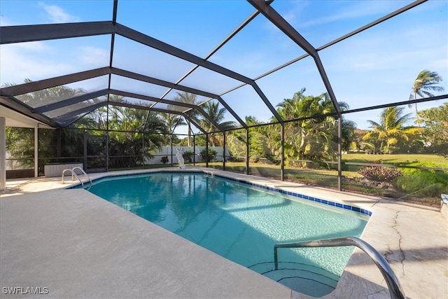 view of swimming pool featuring a lanai and a patio area