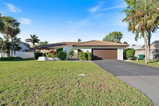 view of front facade with a garage and a front yard