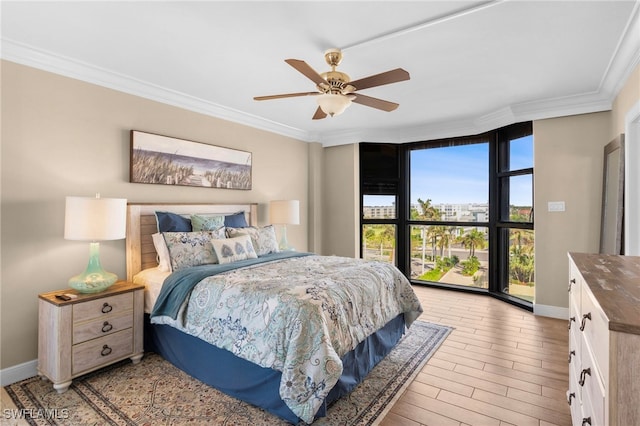 bedroom with a wall of windows, ceiling fan, ornamental molding, and light wood-type flooring