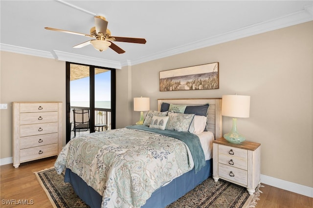 bedroom featuring ceiling fan, access to exterior, dark wood-type flooring, and crown molding