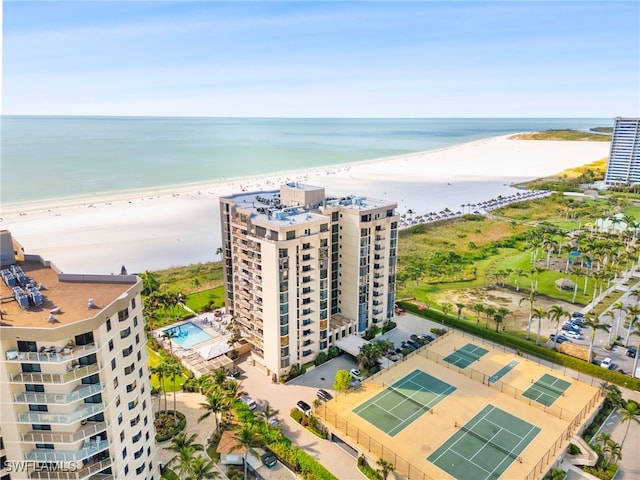 bird's eye view with a water view and a view of the beach