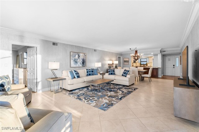 living room featuring light tile patterned flooring, crown molding, and an inviting chandelier