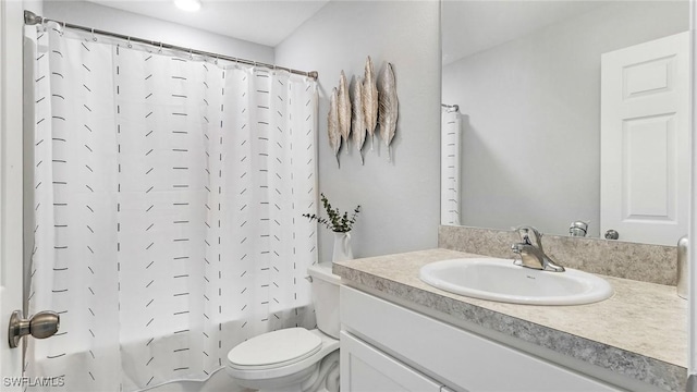 full bathroom with shower / tub combo, vanity, and toilet