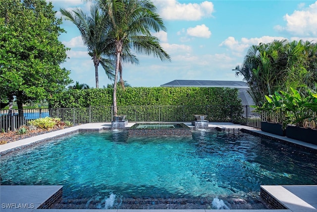 view of pool with an in ground hot tub