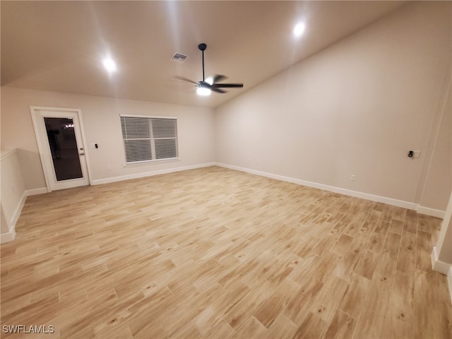 spare room with light wood-type flooring and ceiling fan