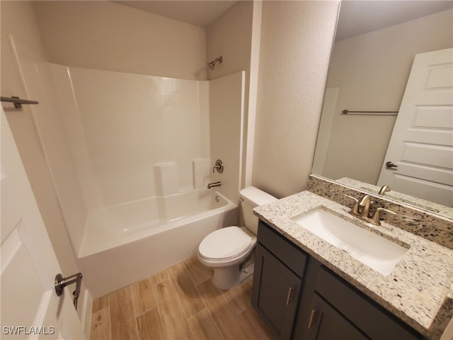 full bathroom with hardwood / wood-style floors, vanity, toilet, and tub / shower combination