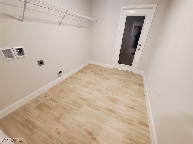 laundry room featuring hookup for an electric dryer, hookup for a washing machine, and light hardwood / wood-style flooring