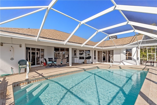 view of pool featuring a lanai and a patio area