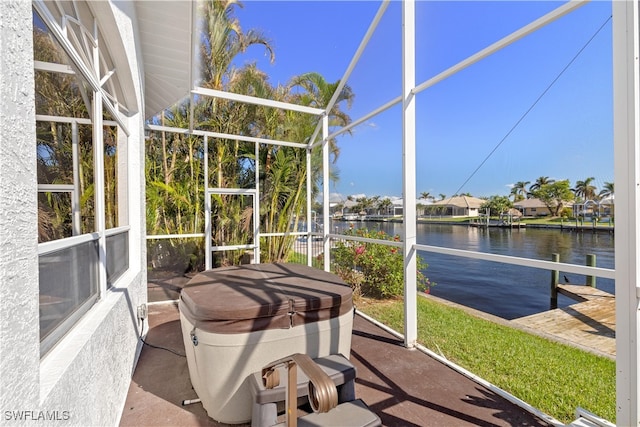 sunroom with a water view