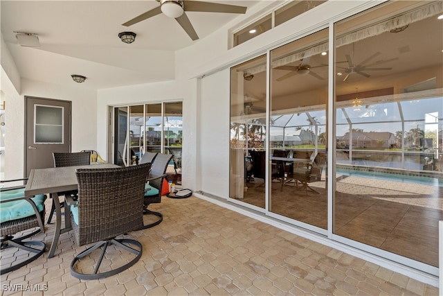 sunroom with a water view and a wealth of natural light