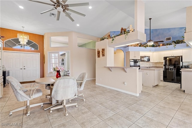 dining area with ceiling fan with notable chandelier, high vaulted ceiling, and light tile patterned flooring