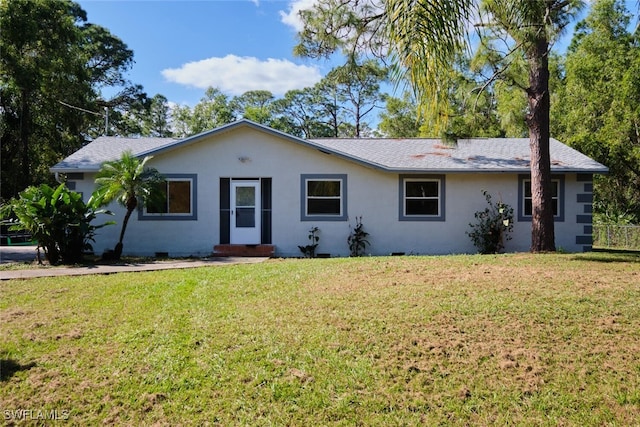 ranch-style home with a front lawn