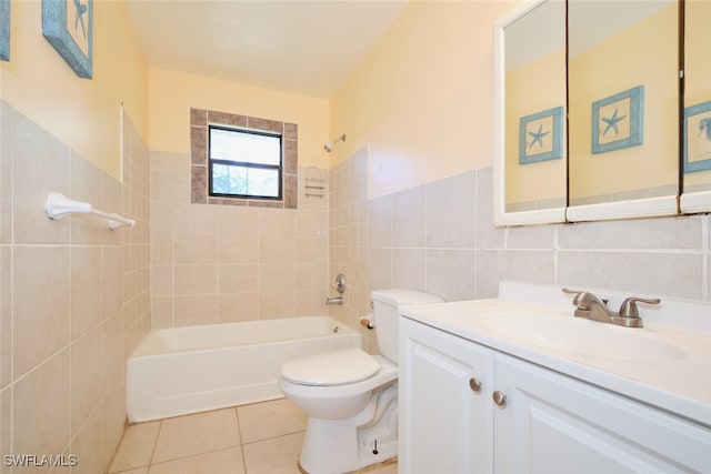 full bathroom with tile patterned floors, vanity, tiled shower / bath combo, tile walls, and toilet