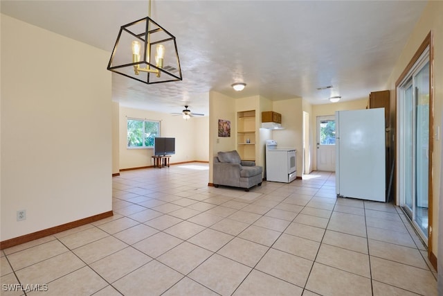 unfurnished living room with light tile patterned floors and ceiling fan with notable chandelier