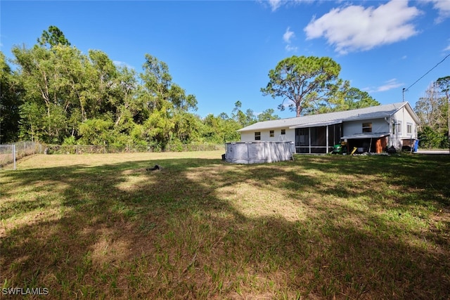 view of yard featuring a sunroom