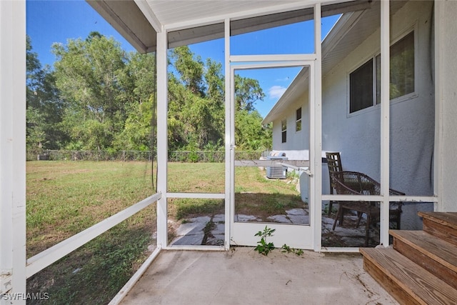 unfurnished sunroom with vaulted ceiling and a healthy amount of sunlight