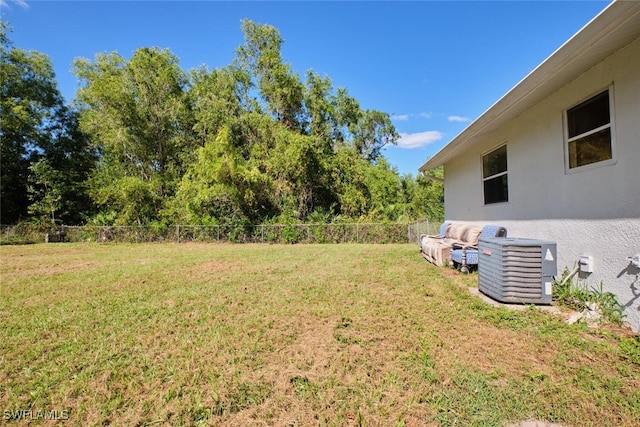 view of yard with central AC