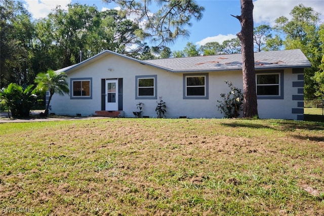 single story home with a front lawn