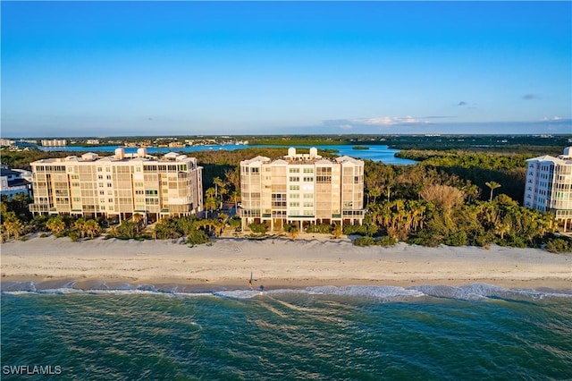 aerial view with a water view and a beach view