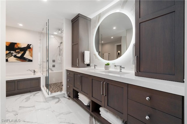 bathroom featuring vanity and separate shower and tub