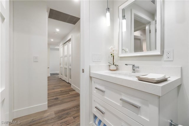 bathroom featuring vanity and wood-type flooring