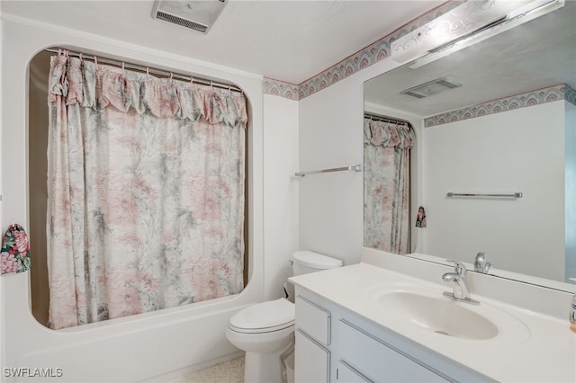 full bathroom featuring vanity, shower / bath combination with curtain, and toilet