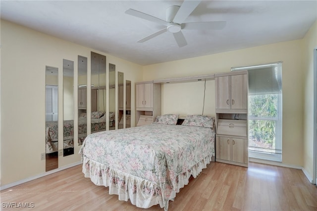 bedroom featuring ceiling fan and light hardwood / wood-style flooring