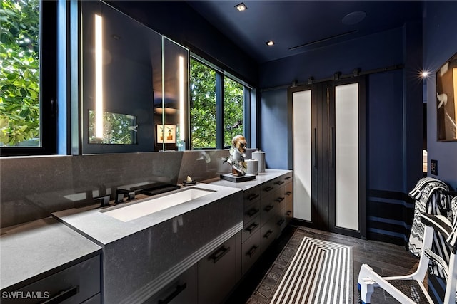 bathroom featuring decorative backsplash and vanity