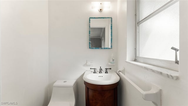 bathroom with vanity and toilet