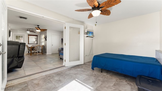 bedroom with french doors and ceiling fan