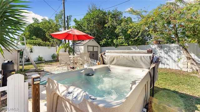 exterior space with a hot tub and a shed