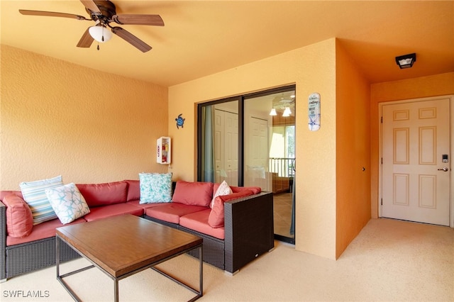 living room with carpet flooring and ceiling fan