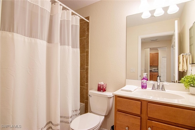 full bathroom featuring vanity, shower / bath combination with curtain, and toilet