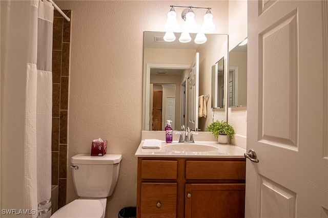 full bathroom with vanity, toilet, and shower / tub combo